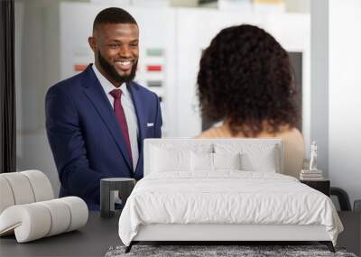 Smiling Car Seller Shaking Hands With Female Customer After Successful Deal Wall mural