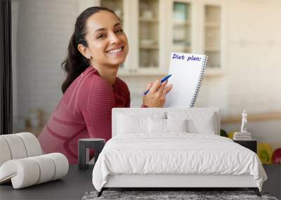 Smiling Fit Woman Posing With Diet Plan In Modern Kitchen Wall mural