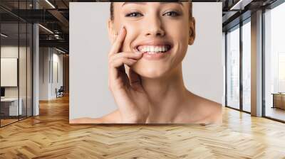 Stomatology concept. Girl with strong white teeth Wall mural