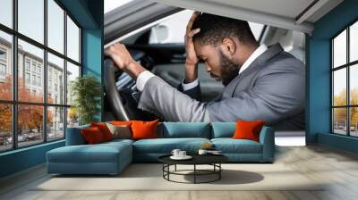 Stressed businessman feeling headache in car, stop the car Wall mural