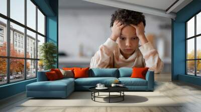 Stressed Little Black Boy Reading Book At Home And Touching Head Wall mural