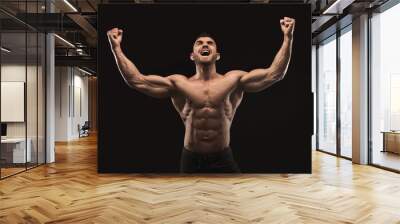 Strong athletic man showes naked muscular body Wall mural