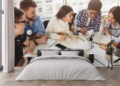 Students reading reference books for study notes Wall mural