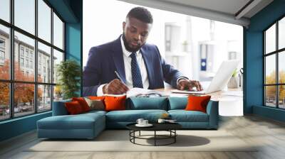 Successful black businessman working hard in office Wall mural