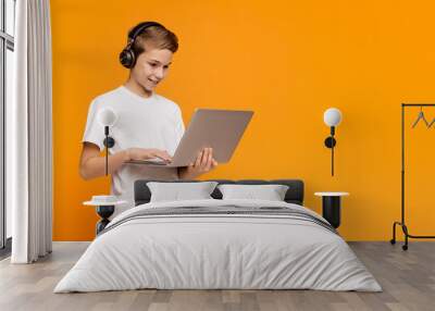 Teenage student watching webinar online on laptop Wall mural