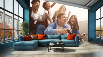 Teenagers having fun, playing video games online Wall mural