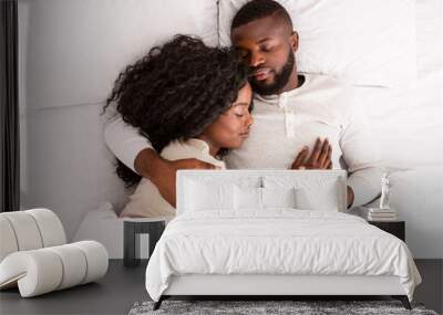 Top view of african american couple sleeping together in bed Wall mural