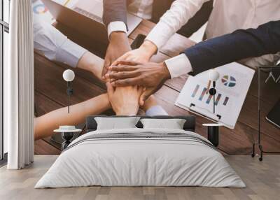 Top view on diverse corporate team hands stacked together Wall mural