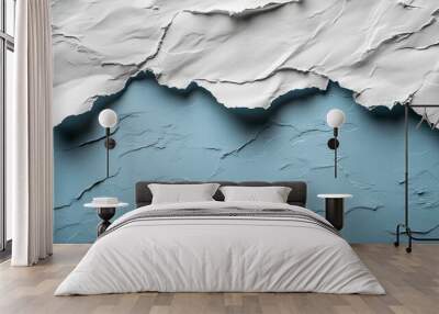 Torn white paper edges create a dynamic contrast against a textured blue background, showcasing the interplay of materials and colors artistically. Wall mural