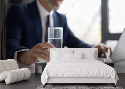 Unrecognizable Middle Aged Businessman Holding Glass Of Water While Sitting In Office Wall mural