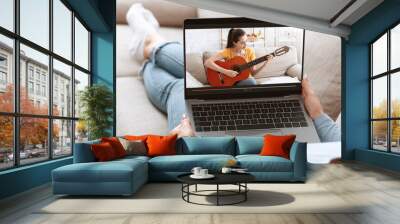 Unrecognizable young woman watching online music lesson, learning how to play guitar on web from home, collage Wall mural