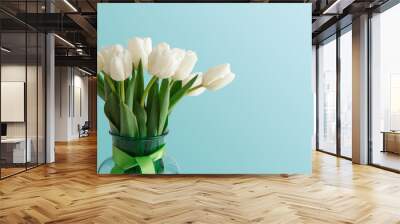 White tulips bouquet on blue background Wall mural