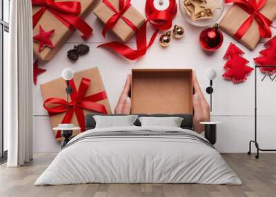 Woman hands holding empty Christmas gift box Wall mural