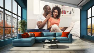 Young black couple working on laptop, copy space Wall mural