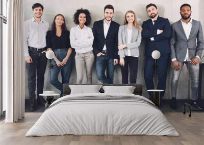 Young business colleagues smiling together to camera Wall mural