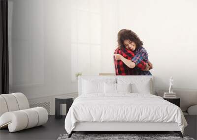 Young happy black couple dancing at home, copy space Wall mural