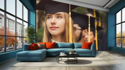 Young serious woman on her graduation day Wall mural