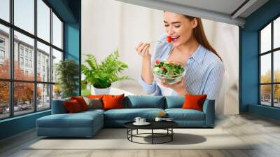 Young Woman Eating Healthy Salad With Fresh Vegetables Wall mural