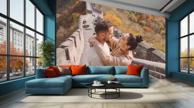 beautiful young couple showing affection on the Great Wall of China. Newly married couple on their honemoon to Great Wall near Beijing China. Stylish couple exploring one of the wonders of the world Wall mural