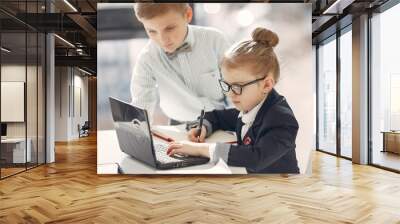 Business theme. Children in a business style. Kid with a laptop. Wall mural