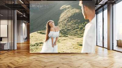 Couple walk in the mountains Wall mural