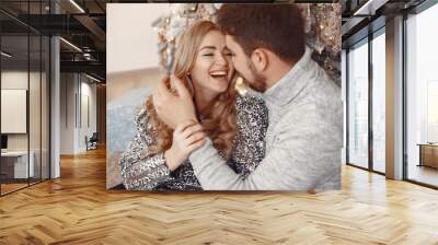 Elegant couple celebrate new year in the room Wall mural