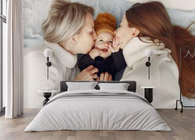 Family at home. Grandmother with daughter and granddaughter. Women in a white sweaters. Wall mural