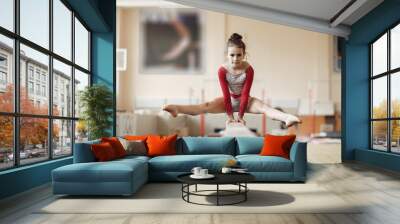 Prepare young child athlete gymnast on balance beam Wall mural