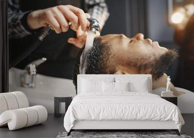 Young African-american man visiting barbershop Wall mural