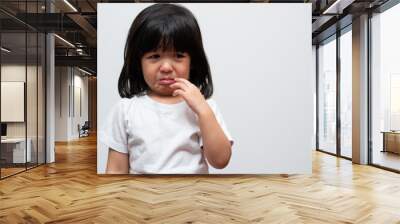 Portrait of Asian angry, sad and cry little girl on white isolated background, The emotion of a child when tantrum and mad, expression grumpy emotion. Kid emotional control concept Wall mural