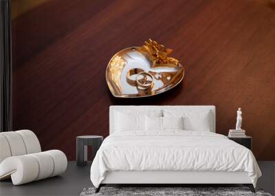 Gold wedding rings on the stand for rings Wall mural