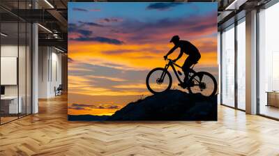 Man on mountain bike against sundown sky silhouette Wall mural