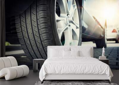 Car tire close up, parked car low angle shot Wall mural