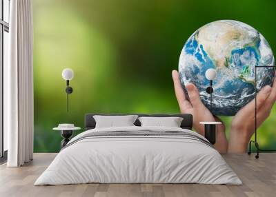 Hands raised to Earth. Environment protection Wall mural