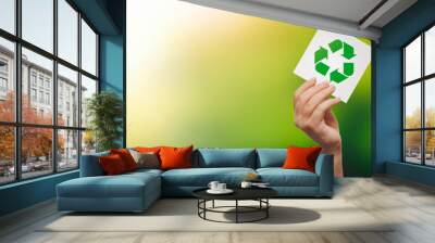 Recycling symbol in hand. Ecology concept Wall mural