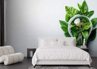 Eco-friendly concept with a light bulb filled with green leaves and a small plant, symbolizing renewable energy and sustainability. Wall mural