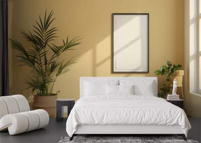 Minimalist interior with potted plants, sunlight, and blank picture frame on beige wall - perfect for design presentations. Wall mural