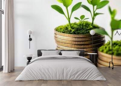 Stacked coins with green plants sprouting, symbolizing financial growth, investment, and economic prosperity in a white background. Wall mural