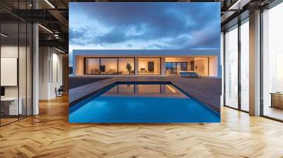 Modern house with a swimming pool and a wooden deck in front of it. Wall mural