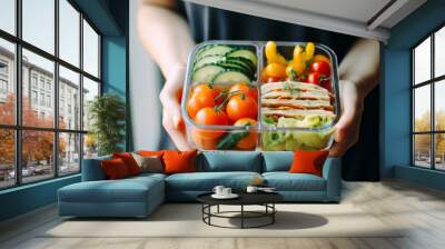 Man having lunch. He is eating healthy balanced lunch after workout. Prepared meal ready to eat. Lunch in container. Having lunch at work. Catering service. Healthy office box with sliced vegetables Wall mural