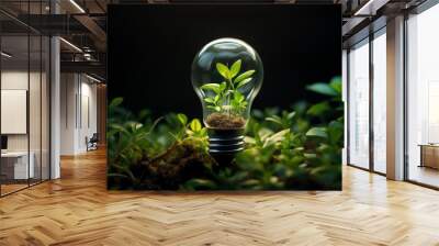 A light bulb with a plant growing inside it. The light bulb is glowing, and the plant is green and healthy. The image is set against a dark background. Wall mural