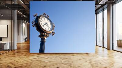 clock post with blue sky Wall mural