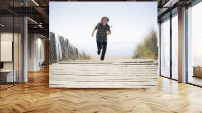 Boy Running On Beach Walkway Wall mural