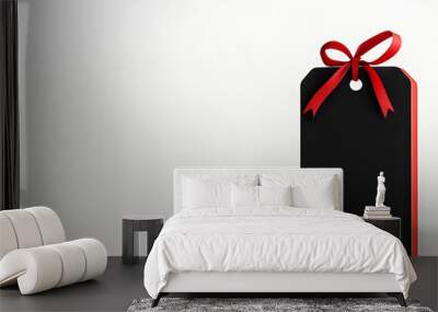 Elegant red gift box with a black tag, perfect for celebrations, holidays, and special occasions. Simple and stylish design. Wall mural