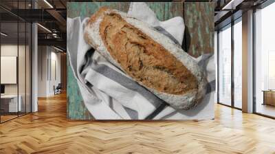 Homemade sourdough bread on authentic cloth . Wall mural