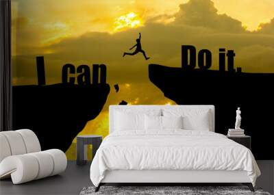 Man jumping on I can do it or I can't do it text over cliff on sunset background,Business concept idea Wall mural