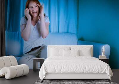 Woman on the phone while watching TV Wall mural