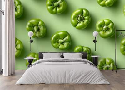 Seamless pattern of fresh green bell peppers on a solid green background. Perfect for food, vegetarian, and healthy eating concepts. Wall mural