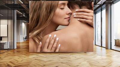 Beautiful Young Woman Smelling Man Smooth Skin. Couple In Love Wall mural