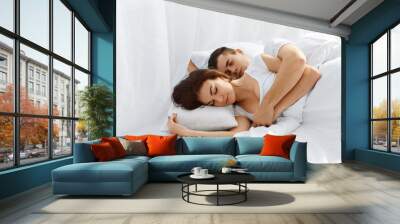 Couple sleeping in bed Wall mural